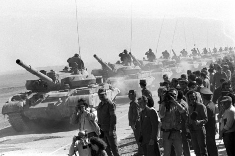 A column of the soviet tankers leaving afghanistan for their motherland , the withdrawal of the soviet forces was concluded on february 15, 1989.