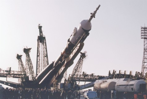 Baikonur, kazakhstan , april 26, 2001, a souyz tm-32 spacecraft with a booster-rocket pictured being erected at a launching site of baikonur cosmodrome on thursday , the launch of a russian crew and t...