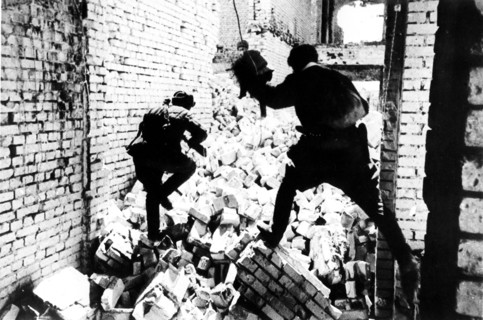 Battle of stalingrad, 1942: red army soldiers engaged in street fighting with german army .