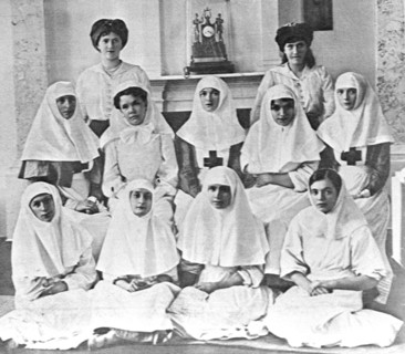 World war one, russia, the personnel of the dispensary of the tsarskoye selo grand palace, 1915: (second row, sitting from left) empress alexandra fyodorovna and grand duchesses olga nikolayevna and t...