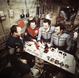 The crews of soyuz 26 and soyuz 28 missions (vladimir remek, alexei gubarev, oleg makarov and georgi grechko) open mail aboard the salyut 6 space station, march 1978.