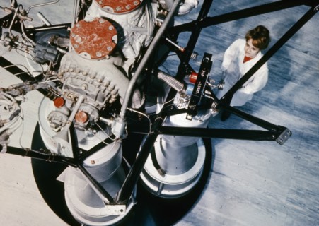 Soviet technician inspecting part of an  rd-? rocket engine installed in the second stage of cosmos carrier rockets, 1969.