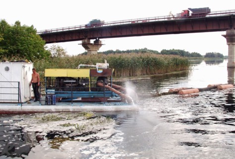 Russia, voronezh region, piles of the bridge across the voronezh river located at the 500th kilometre of the 'don'' federal highway are strengthened by sand, october 14, 2004.