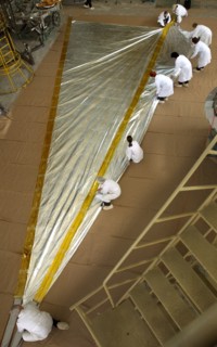 Specialists of lavochkin scientific production association are packing a part of sunlight-propelled solar sail spacecraft while preparing it for the launch, moscow region, russia, april 7, 2004.
