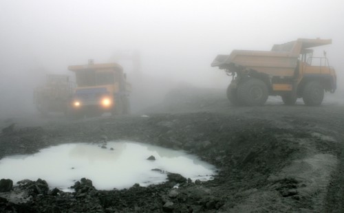 Oao 'kongor-chrom' mines, mining of chromium ore in the ural region of russia, belaz dump trucks, september 2006.