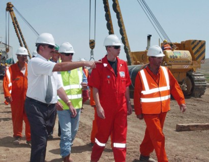 Azerbaijan, august 11, 2003, head of azerbaijan government ilkham aliyev (l) pictured visiting the construction site of the baku-ceyhan oil pipe line,on monday.