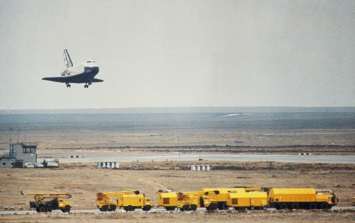 Soviet space shuttle buran landing at the yubileiniy airfeild at baikonur in kazakhstan, ussr after an unmanned test flight, november 1988.