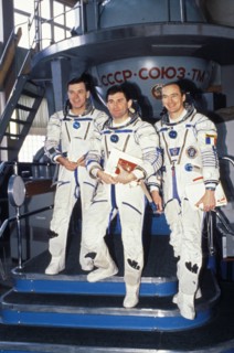Soyuz tm-17, aleksandr serebrov, vasily tsibliyev, and jean-pierre haignere in front of a soyuz simulator during training, 1993.