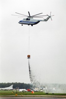 A russian mi-26 helicopter - the world's biggest - demonstrating it's fire-fighting capabilities at the farnborough air show in 1992.