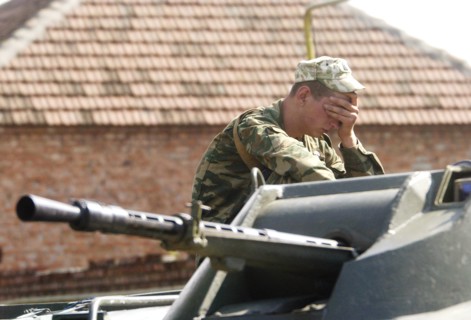 Beslan (north ossetia), russia, september 2, 2004, servicemen on guard around the building of the school no 1 in the city beslan seized by terrorists.