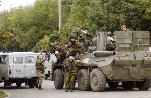 Special forces soldiers take position at a seized school in beslan, north ossetia, friday, sept, 3, 2004.