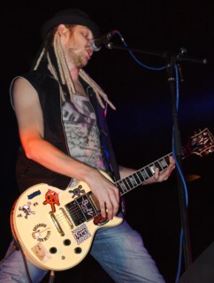 Dmitry kezhvatov of russia's 'the tarakany!' punk group performs at the 'punk higher school, international' festival at moscow's luzhniki sports complex, september 24, 2004.