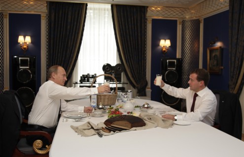 Moscow region, russia, october 1, 2010, president of russia dmitry medvedev (r) and prime minister vladimir putin raise glasses with a sour milk drink (from the ruzskoye moloko dairy company) while ha...