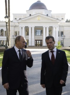Moscow region, russia, october 1, 2010, president of russia dmitry medvedev (r) and prime minister vladimir putin chat during a walk at gorki residence.