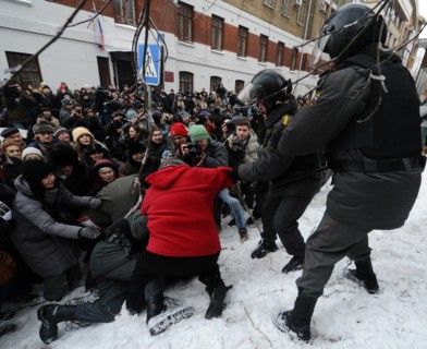 Moscow, russia, december 27, 2010, riot police scuffle with a demonstrator during a rally of khodorkovsky's supporters outside the khamovniki district court, the court is expected to issue its ruling ...