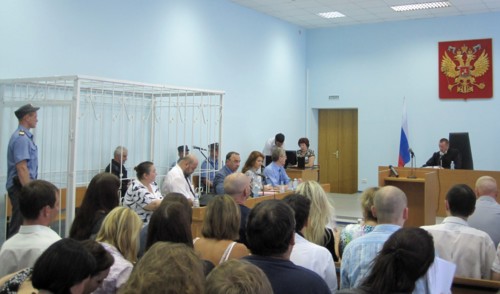 Velsk, arkhangelsk region, russia, july 26, 2011, former director of the menatep company platon lebedev (background l) appears in the dock as the velsk district court in the arkhangelsk region began t...