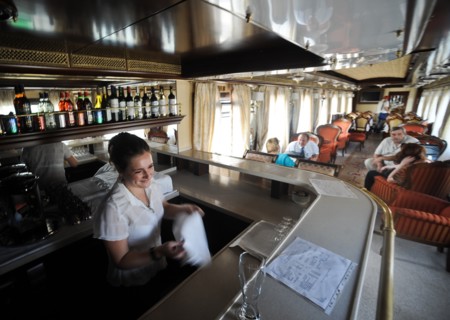 Moscow, russia, august 16, 2011, bar tender in a diner car on a moscow-to-beijing passenger train