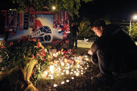 Yaroslavl, russia, september 8, 2011, lokomotiv yaroslavl fans commemorate players of a khl ice hockey team lokomotiv who died in a yak-42 passenger plane crash on september 7 by laying flowers and li...