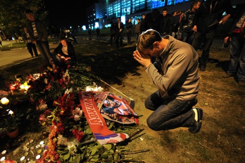 Yaroslavl, russia, september 8, 2011, lokomotiv yaroslavl fans commemorate players of a khl ice hockey team lokomotiv who died in a yak-42 passenger plane crash on september 7 by laying flowers and li...