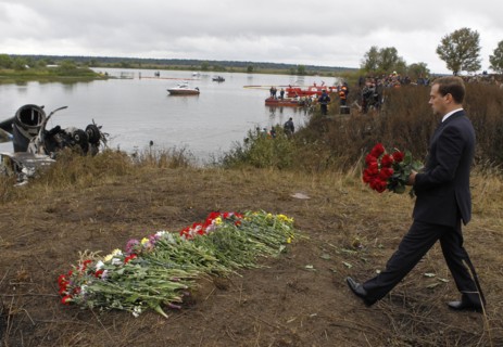 Yaroslavl region, russia, september 8, 2011, president of russia dmitry medvedev laying flowers at the site of the yak-42 plane crash which took the lives of lokomotiv ice hockey team players and coac...