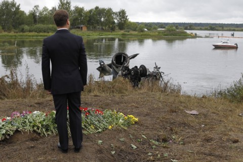 Yaroslavl region, russia, september 8, 2011, president of russia dmitry medvedev laying flowers at the site of the yak-42 plane crash which took the lives of lokomotiv ice hockey team players and coac...