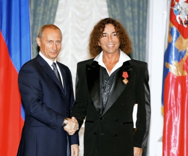 Russian president vladimir putin (left) presents a state award to singer valery leontyev, moscow, russia, july 25, 2005.