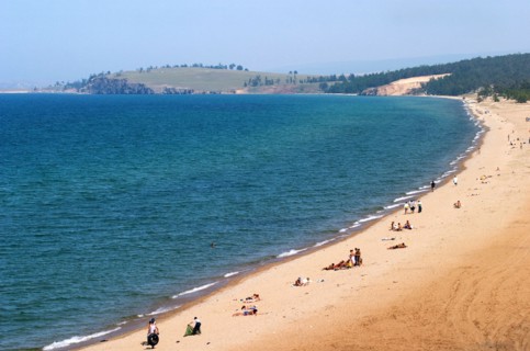 Irkutsk region, russia, holiday-makers on the beach on olkhon island, lake baikal, in summer, august 2005.