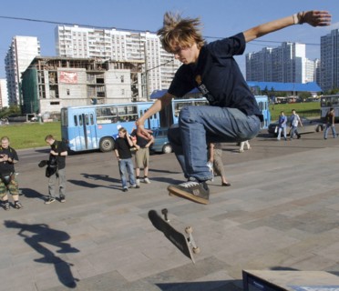 Young people skateboard in moscow's krylatskoye district, august 22, 2005.