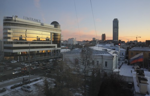 Yekaterinburg, russia, november 28, 2011, night view of vysotsky business centre, a 54 storey skyscraper (far) and 'limerence' shopping center (l).