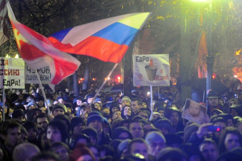 Moscow, russia, december 5, 2011, demonstrators wave flags during an opposition protest in central moscow against alleged vote-rigging in the december 4 parliamentary election.