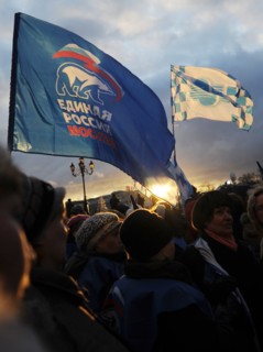 Moscow, russia, december 12, 2011, demonstrators wave flags during a rally staged by pro-kremlin youth groups in central moscow, the event took place two days after a mass protest against alleged vote...