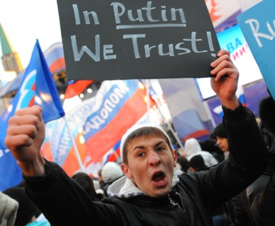 Moscow, russia, december 12, 2011, a young demonstrator holds up a sign reading in putin we trust during a rally staged by pro-kremlin youth groups in central moscow, the event took place two days aft...