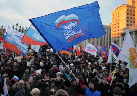 Moscow, russia, december 12, 2011, demonstrators wave flags during a rally staged by pro-kremlin youth groups in central moscow, the event took place two days after a mass protest against alleged vote...