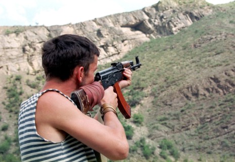 Makhachkala, daghestan, russia, august 12, a daghestani militiaman watch the mountains in the tsumadinsky district,from where chechen gunmen may appear ,the chechen militants who suffered considerable...