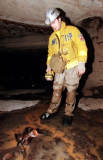 Vadim mikhailov, leader of the organization, diggersof planet underground, with a dead bird found while inspecting underground communication lines, moscow, russia, december 8, 1999.