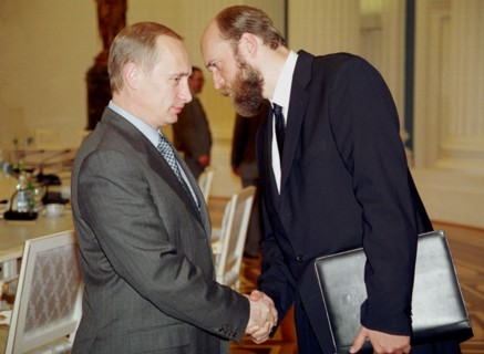 President vladimir putin (l) and chairman of the board of directors of the international industrial bank, sergei pugachyov (r) after the meeting, president vladimir putin met a score of leading russia...