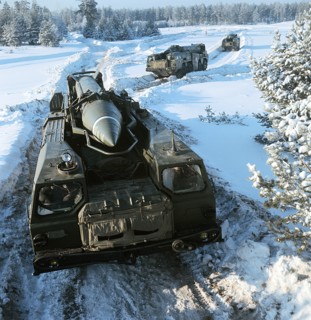 Tactical operational missile complexes 'tochka' rolling through during the military exercises, january 25, 1971.