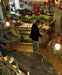 A guest chooses desserts at moscow's grabli (rake) restaurant, moscow, russia, september 2006.