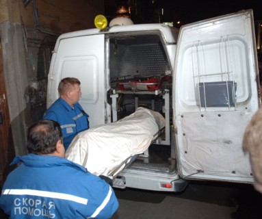 Moscow, russia, october 7, 2006, members of a rescue crew carry out the body of journalist anna politkovskaya, the novaya gazeta special correspondent anna politkovskaya was found shot dead in the hal...