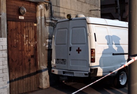 Tv camera lights cast long shadows onto the entrance of the apartment building where russian journalist, the novaya gazeta special correspondent anna politkovskaya was killed, moscow, russia, october ...