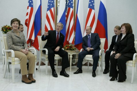 U,s, first lady laura bush, u,s, president george bush, russian president vladimir putin, and russian first lady lyudmila putina, l-r, foreground, smile at a meeting at the vnukovo 2 airport, moscow r...