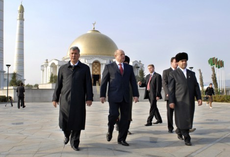 Ashgabat, turkmenistan, february 15, 2007, russian prime minister mikhail fradkov (c) walks after visiting the grave of president of turkmenistan saparmurat niyazov at the mosque called spirit of turk...