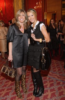 Valentin yudashkin's wife marina (l) and tv host kseniya sobchak pose for a photographer at the party at the metropol hotel after the valentin yudashkin's show at the state kremlin palace, march 9, 20...