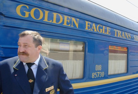 Moscow, russia, june 4, 2007, attendant outside the golden eagle express, the new $25 million fully en-suite private train has been launched by long-distance luxury train operator gw travel limited to...