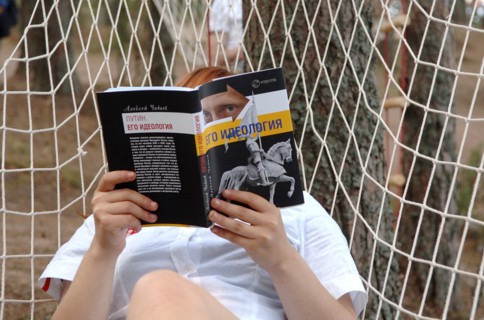 Nashi member reading alexei chadayev's book 'putin: his ideology', his ideologyi´ at the summer camp of the pro-putin nashi (our people) youth movement at the lake seliger resort, tver region, russia,...