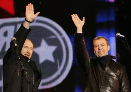 Moscow, russia, march 2, 2008, outgoing president vladimir putin (l) and first deputy prime minister dmitry medvedev wave to the audience during a concert in vasilyevsky spusk off red square, marking ...
