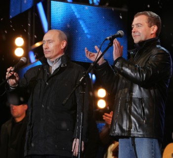 Moscow, russia, march 3, 2008, outgoing president vladimir putin (l) and first deputy prime minister dmitry medvedev address the audience during a concert in vasilyevsky spusk off red square, marking ...