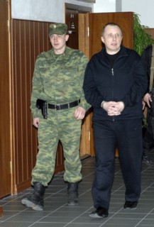 Moscow, russia, april 23, 2008, former yukos security chief alexei pichugin (r) is being escorted at the moscow city court where he denied that he had ever received orders to commit murder from billio...