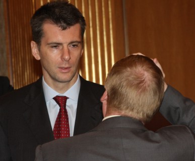 Moscow, russia, october 16, chairman of the board of polyus gold company, onexim group's owner mikhail prokhorov (background) attends a meeting of the organising committee to prepare for the nanotechn...