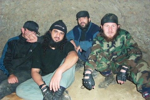 Moscow, russia, july 26, 2002, khattab's right-hand man isayev, aka the 'elsi the red', achimez gochiyayev, khattab and his bodyguard (r-l) seen in the photo made public by the federal secirity servic...
